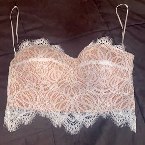 Super cute top! White lace with nude lining!